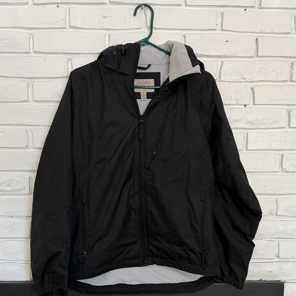Women’s Cabellas Hooded Rain Jacket.size Medium